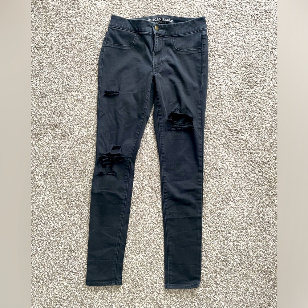 Distressed black jeggings